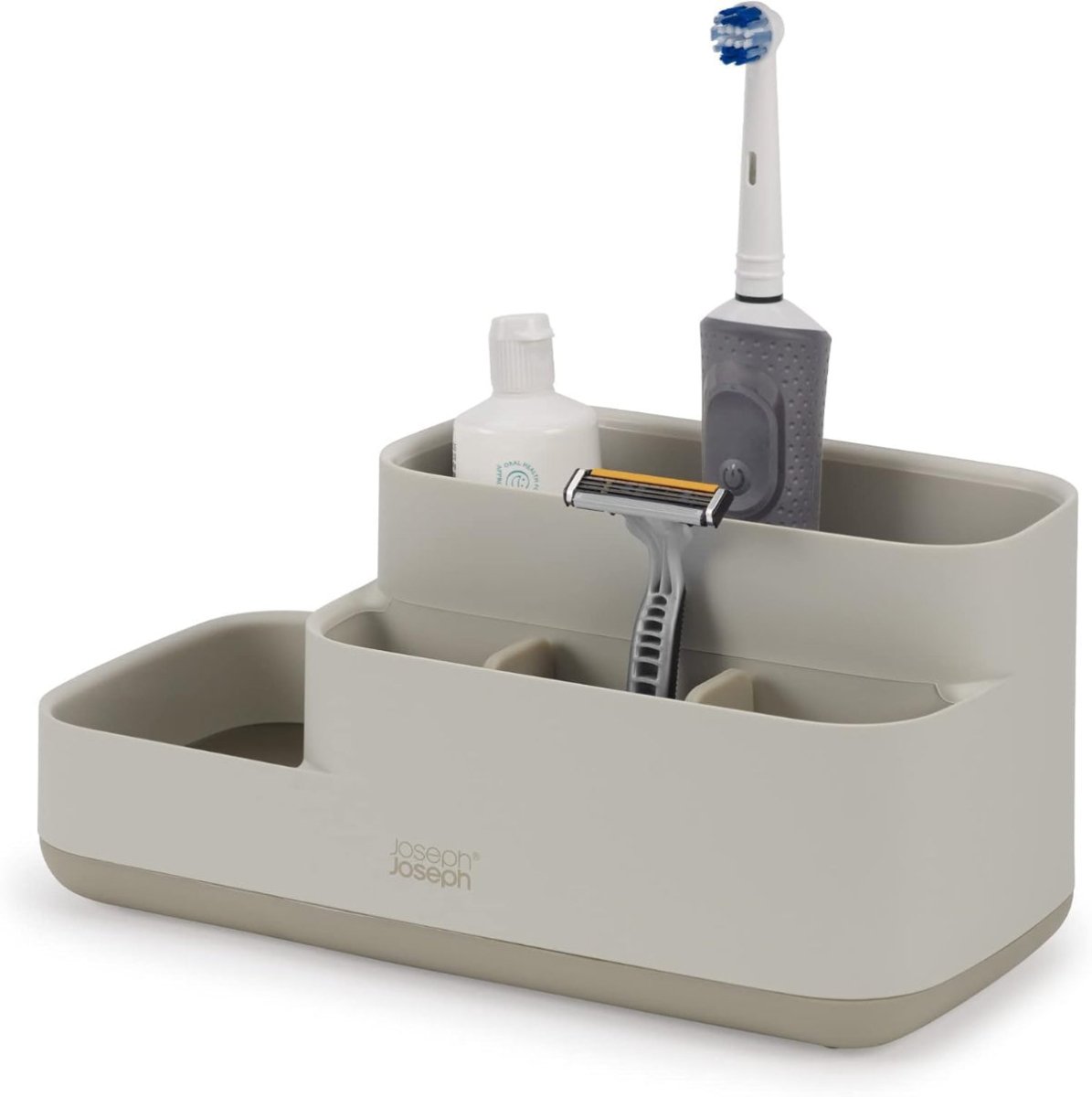Organized bathroom counter with Joseph Joseph EasyStore Caddy filled with toiletries like toothbrushes, toothpaste, and skincare products