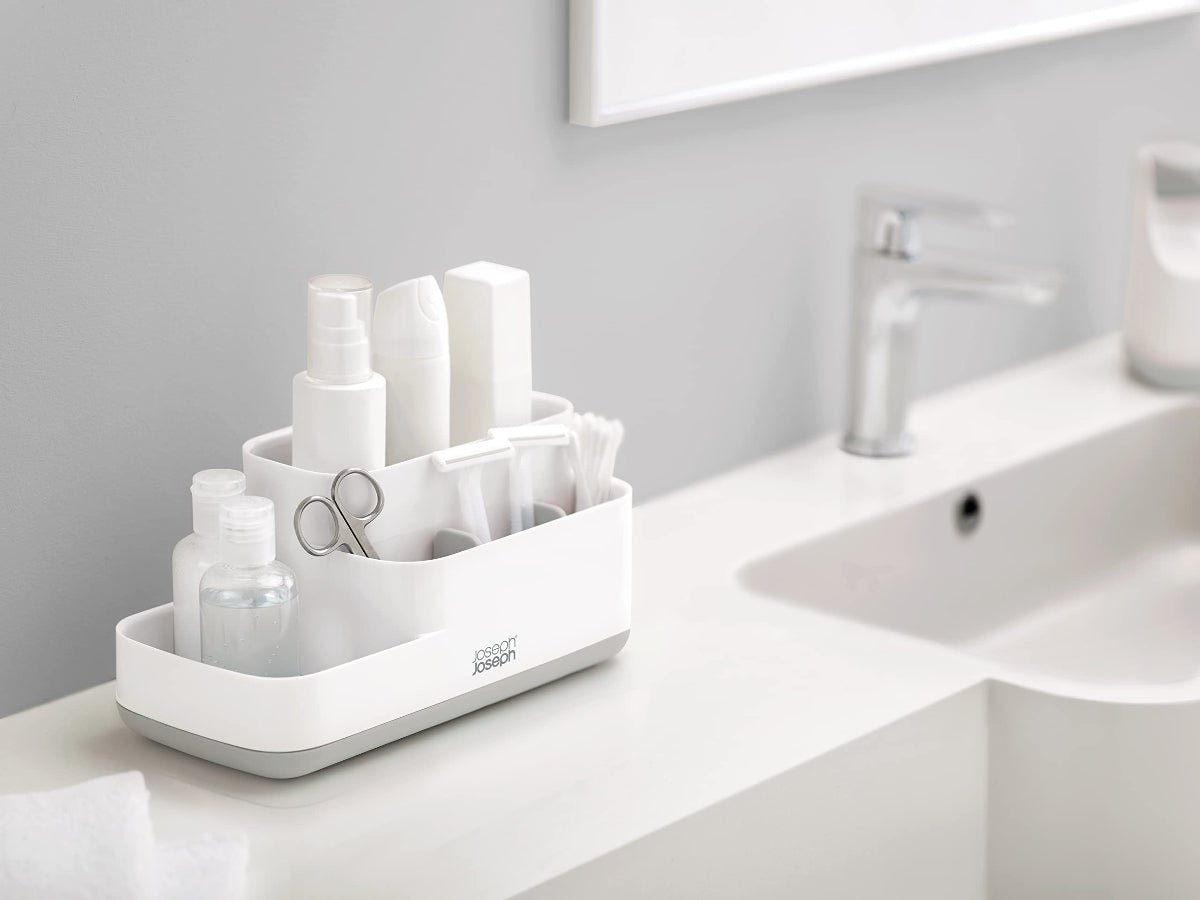 Modern bathroom with a white Joseph Joseph EasyStore Caddy on the counter, showcasing its compact and stylish design