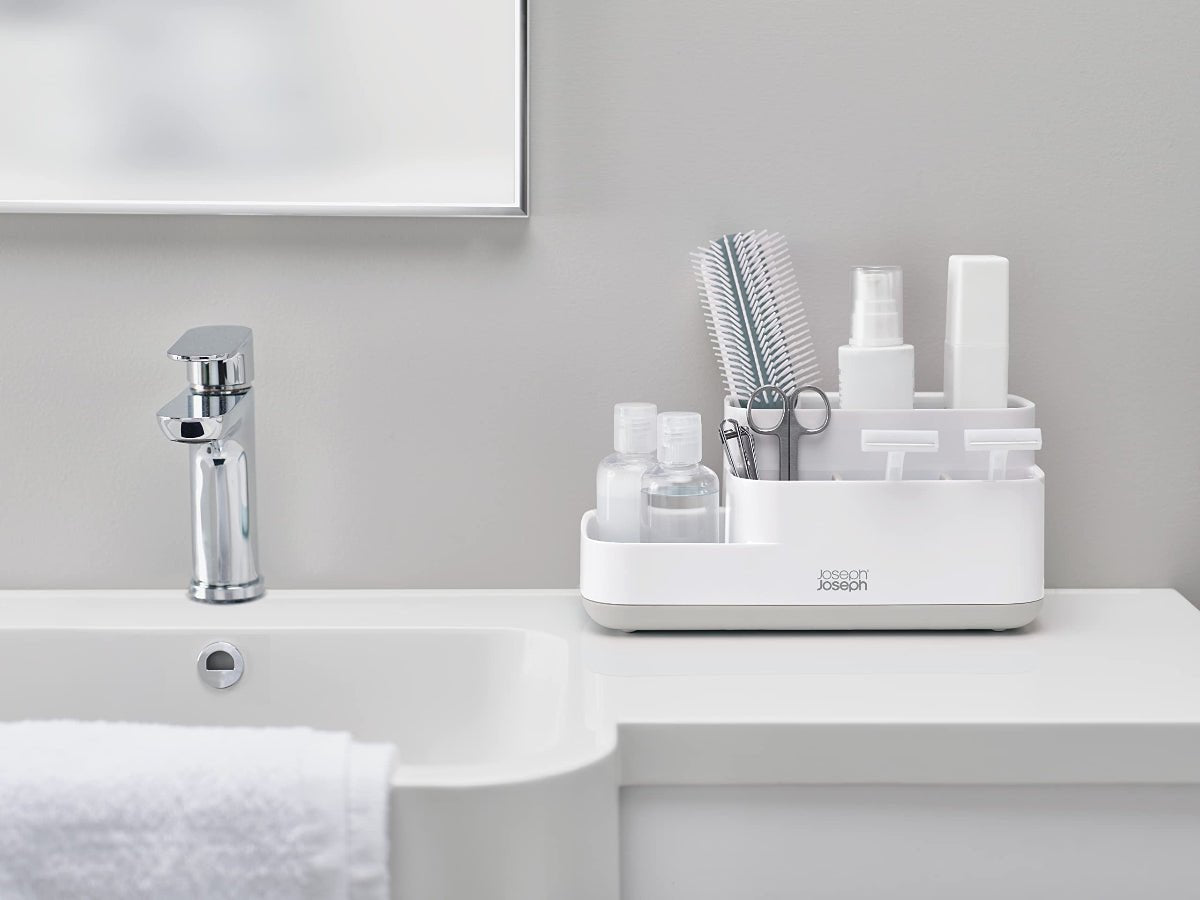 Modern bathroom with a white Joseph Joseph EasyStore Caddy on the counter, showcasing its compact and stylish design