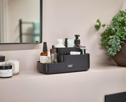 Close-up view of the Joseph Joseph EasyStore Caddy's compartments, showing various sizes and depths for different items